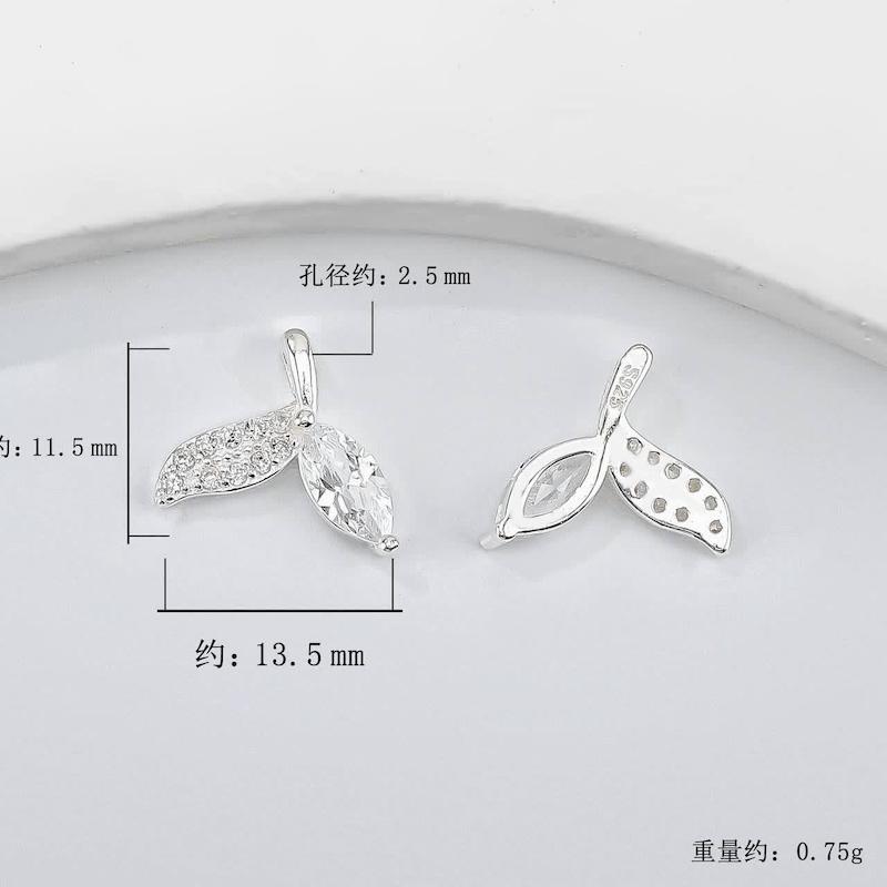 https://mrkharazi.com/product/Swarovski Whale Tail Necklace