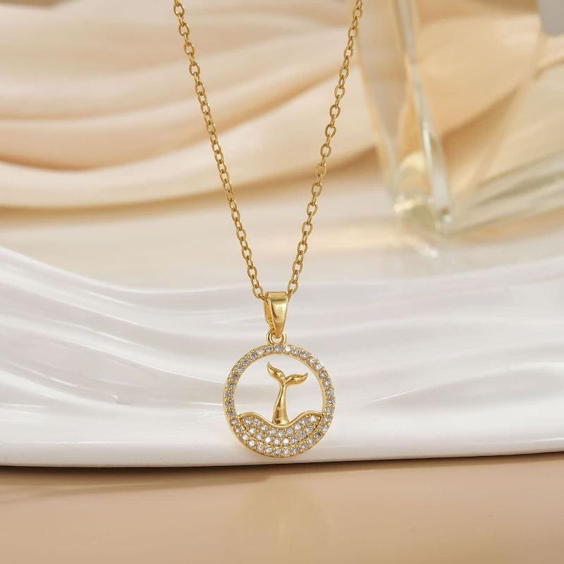 https://mrkharazi.com/product/Swarovski Whale Tail Necklace