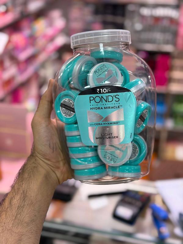 کرم مرطوب‌کننده مینی پوندز POND'S Hydra Miracle با بسته‌بندی گرد سبز و سفید