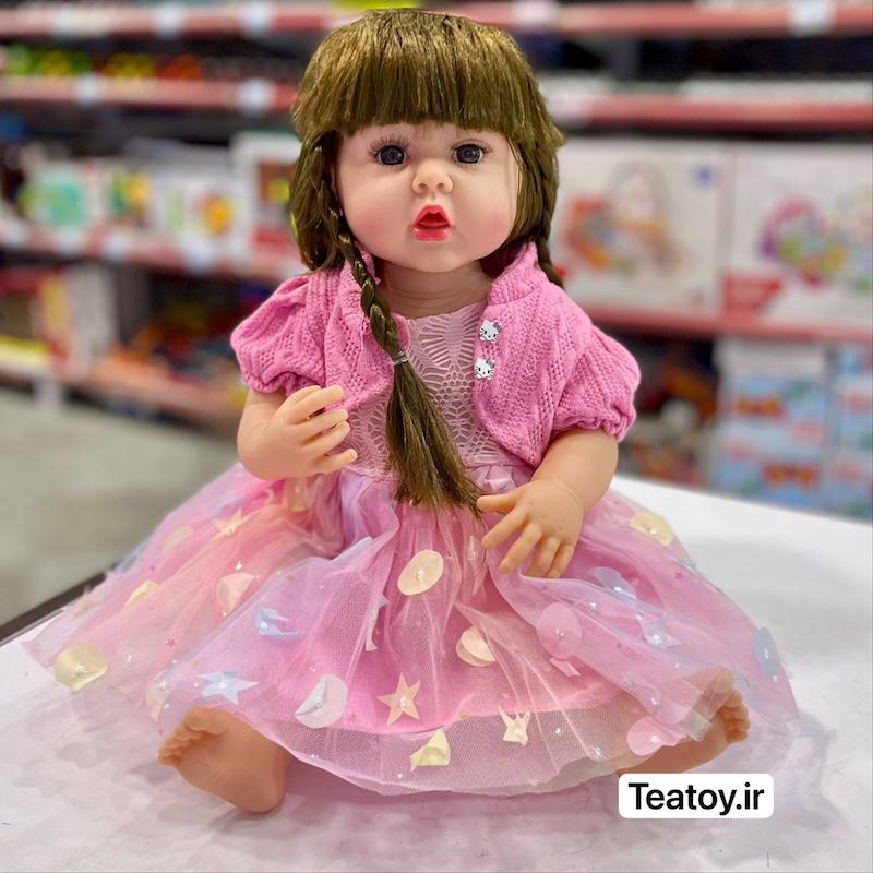عروسک سلیکونی سنسوری ۵۰ سانتی جعبه‌ای با لباس صورتی و دامن توری (مو بلند)