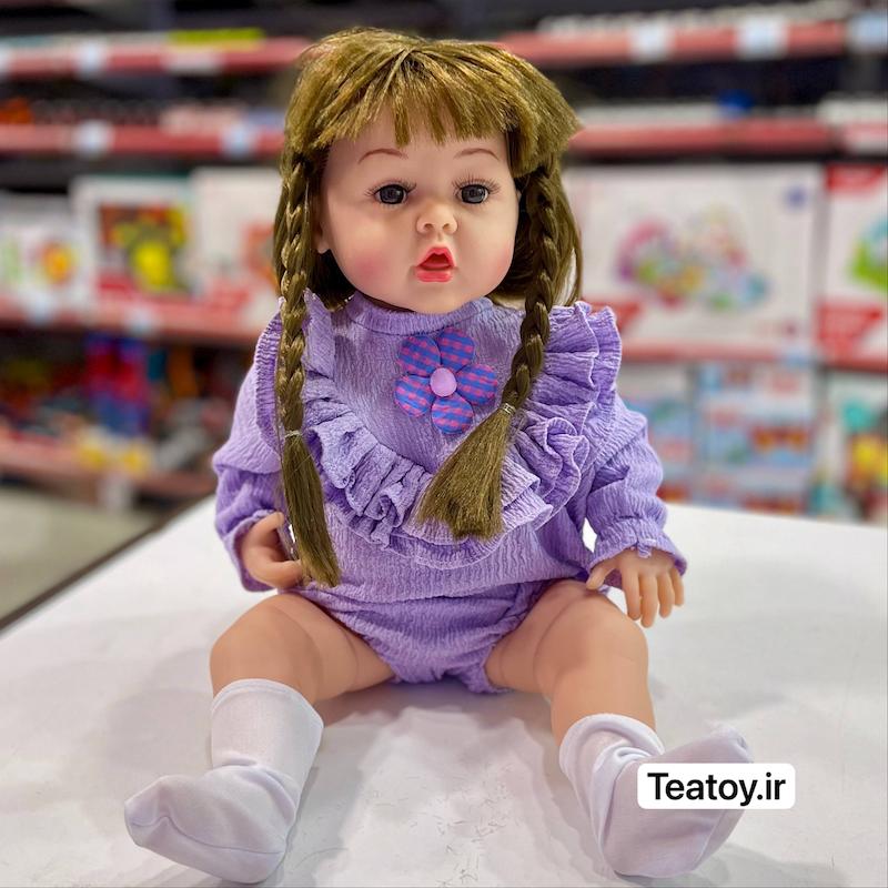 عروسک سلیکونی سنسوری ۵۰ سانتی جعبه‌ای با لباس بنفش (مو بلند)