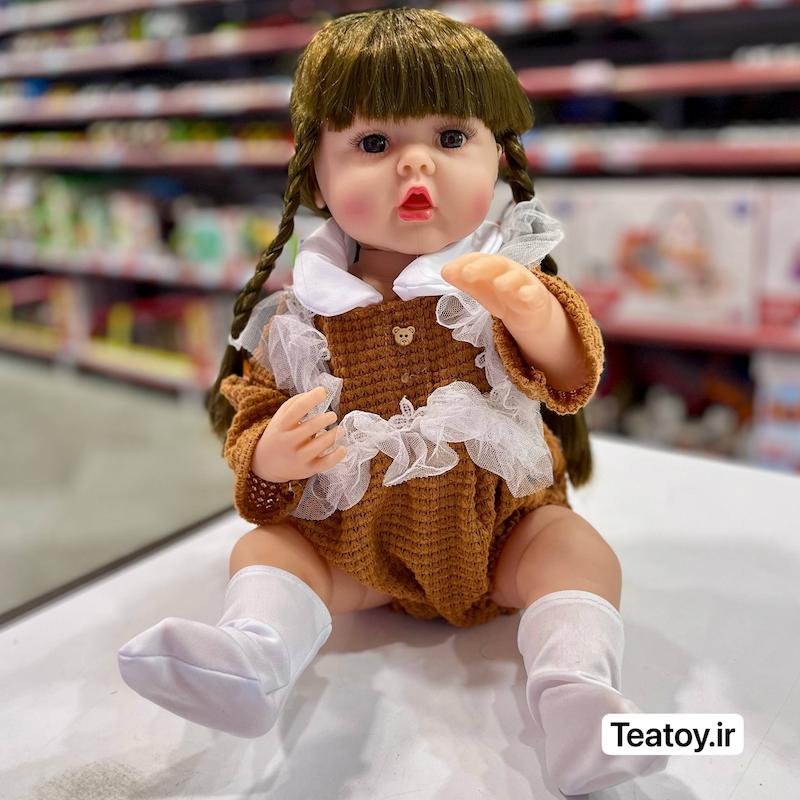 عروسک سلیکونی سنسوری ۵۰ سانتی جعبه‌ای با لباس قهوه‌ای