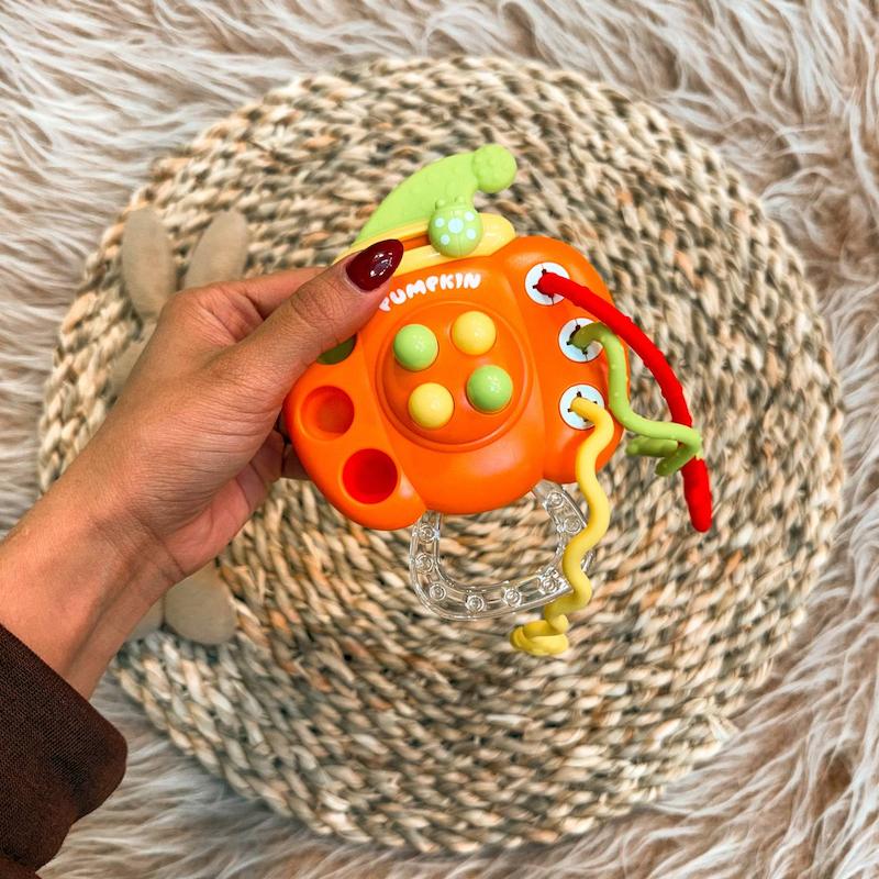 اسباب بازی دست ورزی نوزاد مدل کدو حلوایی