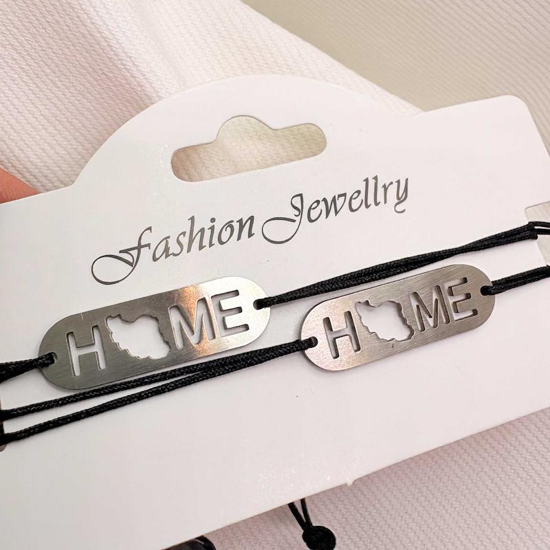 دستبند استیل مدل «HOME - ایران» | بند بافت مشکی با پلاک نقره‌ای