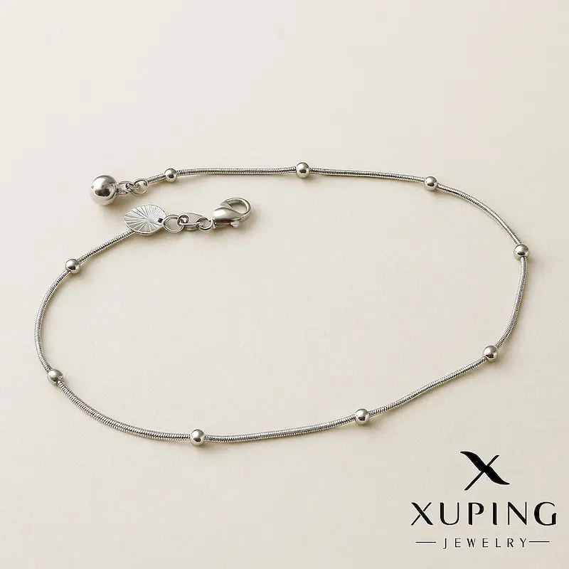 پابند استیل نقره‌ای زنانه مدل مینیمال با مهره برجسته – Xuping