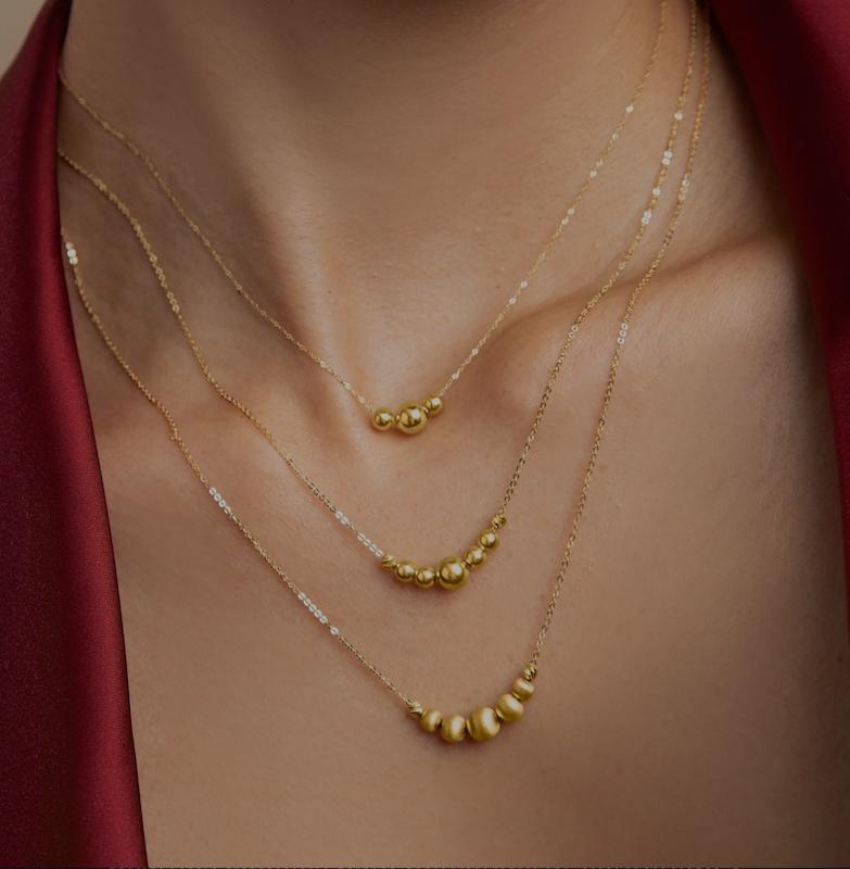گردنبند زنانه طلا ۱۸ عیار گردنبند سه لاین متصل وارداتی گوی متصل گالری کاژه گلد