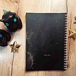 دفتر یادداشت مشکی با طرح کهکشانی و ستاره ها