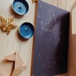 صفحه اول دفتر یادداشت با طرح ماه و ستاره ها در آسمان