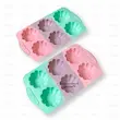 قالب چندخانه سیلیکونی فانتزی در رنگ‌های سبز، بنفش و صورتی با شکل گل و صدف، چیدمان مورب برای نمایش تنوع رنگ محصول.
