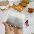 فیلتر چای ارکیده مدل کیسه ای 2 بسته 60 عددی به همراه قاشق چای