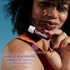 بالم لب روزانه لبلو رطوبت رسانی 24 ساعته رایحه بلک بری کد 65659870 labello fruity shine blackberry 4.8 g with a blackberry aroma www.poonelstore.com