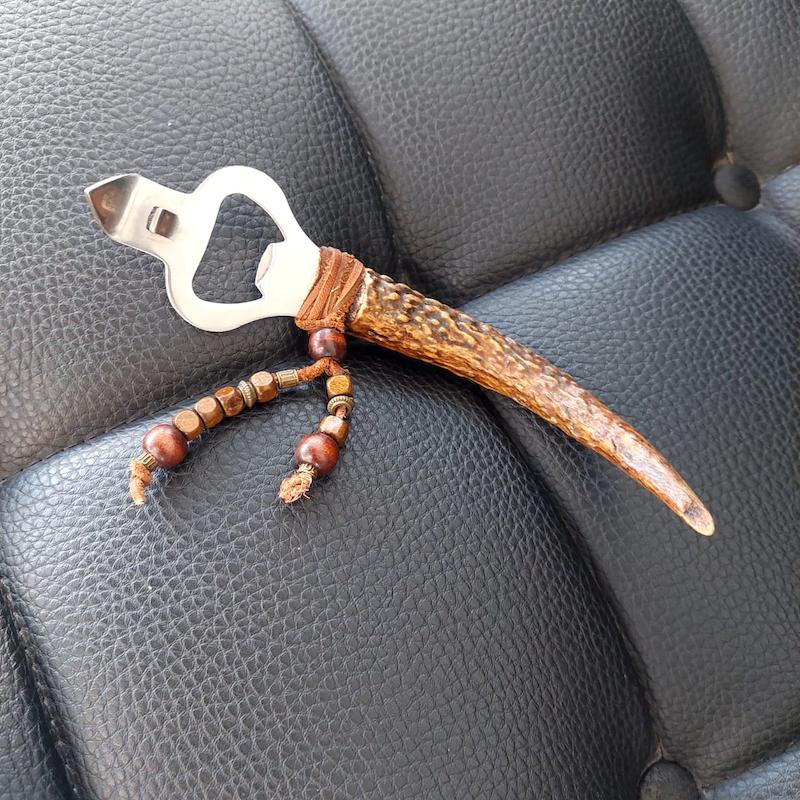 در بازکن نوشابه سر شاخ گوزن