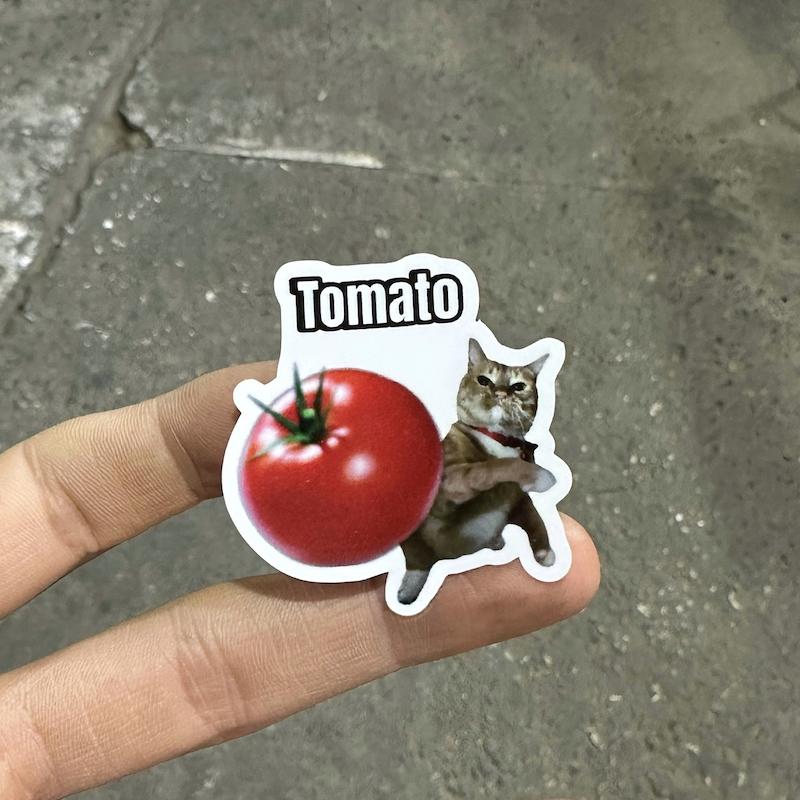 استيكر "گربه گوجه پرت كن"
