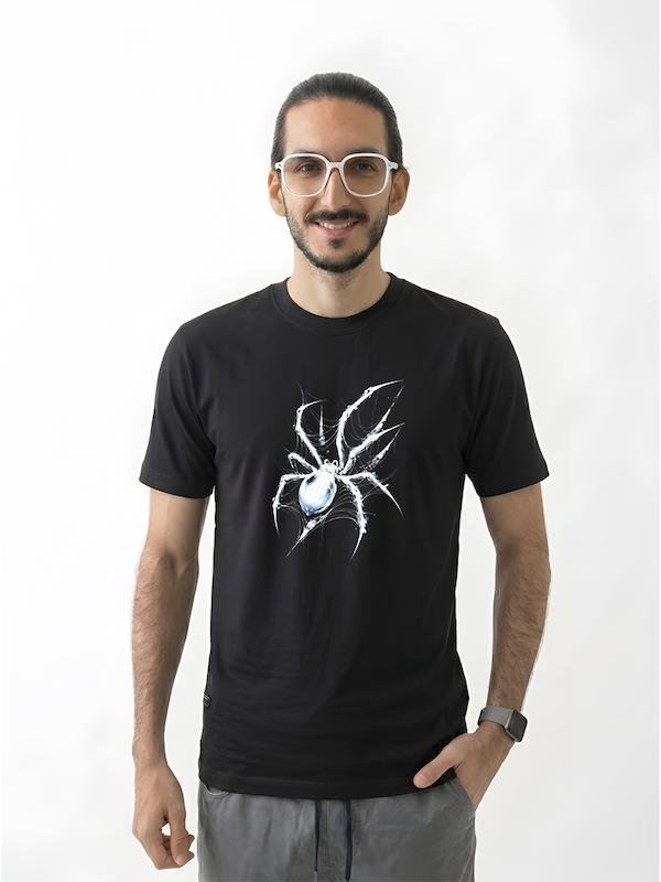 # تیشرت طرح عنکبوت | Spider  **ENTER THE DARK WEB**  تیشرت **طرح عنکبوت (Spider)** با الهام از فرم مرموز و جذاب عنکبوت و زیبایی‌شناسی **Dark Art** طراحی شده است. این طرح برای کسانی مناسب است که به گرافیک‌های تیره، نمادهای طبیعت و استایل‌های متفاوت و جسورانه علاقه دارند.  ترکیب فرم عنکبوت با فضای گرافیکی طرح، ظاهری خاص ایجاد کرده که می‌تواند به‌راحتی با استایل‌های **Dark، Streetwear، Gothic و Alternative** هماهنگ شود.  ## 🕷️ Spider؛ نماد قدرت، صبر و رمزآلودگی  عنکبوت یکی از جذاب‌ترین نمادها در هنر و طراحی است. تارهای پیچیده، حرکات دقیق و ظاهر خاص آن باعث شده در فرهنگ‌ها و سبک‌های هنری مختلف، معانی متفاوتی پیدا کند.  در طراحی گرافیکی، **Spider** می‌تواند نمادی از **صبر، تمرکز، قدرت، هوش و دنیای ناشناخته** باشد.  به همین دلیل، تصویر عنکبوت در هنرهای تاریک و سبک‌های گرافیکی مدرن جایگاه ویژه‌ای دارد.  ## 🖤 برای عاشقان Dark Art و طرح‌های خاص  اگر از طرح‌های معمولی فاصله می‌گیرید و به دنبال یک تیشرت با **هویت بصری متفاوت** هستید، طرح Spider می‌تواند انتخاب مناسبی باشد.  مناسب برای:  * علاقه‌مندان به **Dark Art** * طرفداران **Gothic Style** * علاقه‌مندان به Tattoo Art * دوستداران Graphic Design * علاقه‌مندان به طبیعت و حیات‌وحش * طرفداران **Alternative Fashion** * علاقه‌مندان به **Streetwear**  ## 🕸️ یک طرح ساده نیست؛ یک نماد است  عنکبوت موجودی است که بیشتر از چیزی که در نگاه اول به نظر می‌رسد، مفهوم دارد.  تار عنکبوت حاصل **دقت، صبر و نظم** است؛ چیزی که از یک موجود کوچک، ساختاری پیچیده و منحصربه‌فرد می‌سازد.  تیشرت طرح Spider نیز از همین جذابیت بصری و مفهومی استفاده می‌کند تا یک طرح متفاوت برای استایل روزمره ایجاد کند.  **Patience. Precision. Power.**  ## 👕 جنس و کیفیت تیشرت  برای تولید این محصول از **پارچه نخ پنبه خالص** استفاده شده است؛ پارچه‌ای نرم، راحت و مناسب استفاده روزمره.  جنس پنبه‌ای محصول باعث می‌شود تیشرت برای استفاده طولانی‌مدت حس راحتی مناسبی داشته باشد و بتوانید آن را با آیتم‌های مختلف استایل خود ترکیب کنید.  ## 🎨 چاپ طرح Spider  طرح **عنکبوت** با دقت روی پارچه اجرا شده تا جزئیات گرافیکی و فرم اصلی طرح به خوبی دیده شود.  برای حفظ کیفیت چاپ و افزایش دوام آن، توصیه می‌شود تیشرت را با **آب سرد و طبق اصول صحیح شستشو** بشویید و از روش‌های نامناسب شستشو که ممکن است به چاپ آسیب بزند، خودداری کنید.  ## 🕷️ برای کسانی که از متفاوت بودن نمی‌ترسند  بعضی طرح‌ها برای همه نیستند.  طرح Spider برای کسانی است که از **استایل‌های تاریک، مرموز و متفاوت** لذت می‌برند و دوست دارند لباسشان کمی بیشتر از یک پوشش ساده باشد.  یک طرح جسورانه، قابل‌توجه و مناسب برای کسانی که **Dark Aesthetic** را دوست دارند.  **Stay in the shadows.**  ## 📏 سایزبندی  تیشرت طرح **Spider** در سایزهای استاندارد زیر ارائه می‌شود:  * **L** * **XL** * **XXL**  برای انتخاب دقیق سایز، قبل از ثبت سفارش حتماً **جدول سایزبندی** را بررسی کنید.  ## 🎨 رنگ‌بندی  این محصول در رنگ‌های موجود در صفحه محصول قابل سفارش است.  هنگام ثبت سفارش، **رنگ و سایز موردنظر** خود را انتخاب کنید.  ## 📦 ارسال رایگان به سراسر ایران  **ارسال این محصول به تمام نقاط ایران رایگان است.**  ## 🛒 چرا تیشرت طرح Spider؟  * طراحی با الهام از **عنکبوت** * مناسب علاقه‌مندان به Dark Art و Gothic * نماد صبر، تمرکز و رمزآلودگی * انتخابی خاص برای علاقه‌مندان به Tattoo و Graphic Art * مناسب استایل Dark، Alternative و Streetwear * پارچه **نخ پنبه خالص** * چاپ با اجرای دقیق * مناسب استفاده روزمره * سایزبندی **L / XL / XXL** * ارسال رایگان به سراسر ایران  ---  ### مشخصات محصول  | ویژگی          | مشخصات                              | | -------------- | ----------------------------------- | | **نام محصول**  | تیشرت طرح عنکبوت Spider             | | **دسته‌بندی**  | دارک آرت                            | | **جنس**        | نخ پنبه خالص                        | | **سایز**       | L / XL / XXL                        | | **سبک**        | Spider / Dark Art / Gothic          | | **مناسب برای** | علاقه‌مندان به طرح‌های دارک و طبیعت | | **ارسال**      | رایگان به سراسر ایران               |  ---  ### کلمات کلیدی مرتبط  تیشرت عنکبوت، تیشرت طرح عنکبوت، تیشرت Spider، تیشرت طرح Spider، تیشرت Spider Art، تیشرت دارک آرت، تیشرت Dark Art، تیشرت Gothic، تیشرت گاتیک، تیشرت طرح تار عنکبوت، تیشرت تار عنکبوت، تیشرت طرح حیوانات، تیشرت Graphic، تیشرت گرافیکی، تیشرت Tattoo Art، تیشرت طرح تتو، تیشرت Alternative، تیشرت Streetwear، تیشرت دارک، تیشرت طرح خاص، تیشرت مشکی دارک، تیشرت طرح طبیعت، تیشرت عنکبوتی مردانه
