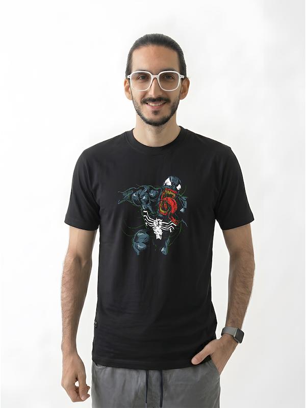 # تیشرت طرح Venom | ونوم  **WE ARE VENOM**  تیشرت **طرح Venom** انتخابی قدرتمند برای طرفداران دنیای مارول، شخصیت‌های ضدقهرمان و فضای تاریک کمیک‌هاست. طراحی این تیشرت با الهام از **Venom**، یکی از شناخته‌شده‌ترین و مرموزترین شخصیت‌های دنیای Marvel، حال‌وهوایی خشن، تاریک و جسورانه به استایل شما می‌دهد.  اگر به **Marvel، Venom، Spider-Man، Dark Art و Graphic Design** علاقه دارید، این تیشرت می‌تواند یکی از آیتم‌های خاص کمد لباس شما باشد.  ## 🕷️ Venom؛ تاریکی درون یک قهرمان  **Venom** یکی از مشهورترین شخصیت‌های دنیای کمیک مارول است؛ موجودی سیمبیوت که با میزبان انسانی خود ترکیب می‌شود و شخصیتی قدرتمند، پیچیده و غیرقابل‌پیش‌بینی را شکل می‌دهد.  ونوم در طول تاریخ کمیک‌های مارول بارها میان نقش **دشمن، ضدقهرمان و شخصیت مستقل** حرکت کرده و همین پیچیدگی یکی از دلایل محبوبیت او در میان طرفداران است.  ظاهر ترسناک، دهان بزرگ، دندان‌های تیز و زبان بلند، ونوم را به یکی از قابل‌تشخیص‌ترین شخصیت‌های دنیای کمیک تبدیل کرده است.  ## 🖤 برای طرفداران Venom و Marvel  اگر از شخصیت‌های معمولی فاصله می‌گیرید و بیشتر به **ضدقهرمان‌ها و کاراکترهای تاریک** علاقه دارید، طرح Venom انتخاب مناسبی برای شماست.  مناسب برای:  * طرفداران **Venom** * علاقه‌مندان به **Marvel** * طرفداران Spider-Man * علاقه‌مندان به Comic Art * دوستداران شخصیت‌های ضدقهرمان * علاقه‌مندان به **Dark Art** * گیمرها و طرفداران فرهنگ Pop Culture * علاقه‌مندان به **Streetwear و Alternative Style**  ## 🔥 WE ARE VENOM  جذابیت Venom فقط به ظاهر ترسناک آن محدود نمی‌شود.  رابطه میان **Venom و Eddie Brock** یکی از بخش‌های مهم داستان این شخصیت است؛ رابطه‌ای پیچیده که در آن دو موجود متفاوت مجبور می‌شوند برای بقا و رسیدن به اهدافشان با یکدیگر همکاری کنند.  همین تضاد میان **انسان و سیمبیوت**، ونوم را به شخصیتی متفاوت در دنیای کمیک تبدیل کرده است.  **We are Venom.**  ## 👕 جنس و کیفیت تیشرت  برای تولید این محصول از **پارچه نخ پنبه خالص** استفاده شده است؛ پارچه‌ای نرم، راحت و مناسب استفاده روزمره.  این تیشرت را می‌توانید با شلوار جین، کارگو، شلوار مشکی و کت‌های اورسایز ترکیب کنید و یک استایل **Dark Streetwear** بسازید.  ## 🎨 چاپ طرح Venom  طرح **Venom** با دقت روی پارچه اجرا شده تا جزئیات گرافیکی و ظاهر قدرتمند شخصیت به خوبی دیده شود.  برای حفظ کیفیت چاپ و افزایش دوام آن، توصیه می‌شود تیشرت را با **آب سرد و طبق اصول صحیح شستشو** بشویید و از روش‌های نامناسب شستشو که ممکن است به چاپ آسیب بزند، خودداری کنید.  ## 🕸️ برای کسانی که سمت تاریک مارول را دوست دارند  در دنیای ابرقهرمان‌ها همیشه قرار نیست قهرمان‌ها کاملاً سفید و بدون نقص باشند.  Venom یکی از جذاب‌ترین نمونه‌های همین تضاد است؛ شخصیتی که مرز میان **قهرمان و ضدقهرمان** را به چالش می‌کشد.  تیشرت طرح Venom برای کسانی است که این بخش تاریک‌تر و متفاوت‌تر دنیای Marvel را دوست دارند.  **Not every monster is the villain.**  ## 📏 سایزبندی  تیشرت طرح **Venom** در سایزهای استاندارد زیر ارائه می‌شود:  * **L** * **XL** * **XXL**  برای انتخاب دقیق سایز، قبل از ثبت سفارش حتماً **جدول سایزبندی** را بررسی کنید.  ## 🎨 رنگ‌بندی  این محصول در رنگ‌های موجود در صفحه محصول قابل سفارش است.  هنگام ثبت سفارش، **رنگ و سایز موردنظر** خود را انتخاب کنید.  ## 📦 ارسال رایگان به سراسر ایران  **ارسال این محصول به تمام نقاط ایران رایگان است.**  ## 🛒 چرا تیشرت طرح Venom؟  * طراحی با الهام از شخصیت **Venom** * مناسب طرفداران Marvel و Spider-Man * انتخابی جذاب برای علاقه‌مندان به ضدقهرمان‌ها * مناسب علاقه‌مندان به Dark Art و Comic Art * مناسب استایل Dark، Streetwear و Alternative * پارچه **نخ پنبه خالص** * چاپ با اجرای دقیق * مناسب استفاده روزمره * سایزبندی **L / XL / XXL** * ارسال رایگان به سراسر ایران  ---  ### مشخصات محصول  | ویژگی          | مشخصات                    | | -------------- | ------------------------- | | **نام محصول**  | تیشرت طرح Venom           | | **دسته‌بندی**  | دارک آرت                  | | **جنس**        | نخ پنبه خالص              | | **سایز**       | L / XL / XXL              | | **سبک**        | Venom / Marvel / Dark Art | | **مناسب برای** | طرفداران Venom و Marvel   | | **ارسال**      | رایگان به سراسر ایران     |  ---  ### کلمات کلیدی مرتبط  تیشرت Venom، تیشرت ونوم، تیشرت طرح Venom، تیشرت ونوم مردانه، تیشرت Marvel، تیشرت مارول، تیشرت Spider-Man، تیشرت اسپایدرمن، تیشرت ضدقهرمان، تیشرت Anti Hero، تیشرت Venom Marvel، تیشرت Eddie Brock، تیشرت دارک آرت، تیشرت Dark Art، تیشرت کمیک، تیشرت Comic، تیشرت Graphic، تیشرت گرافیکی، تیشرت Streetwear، تیشرت Alternative، تیشرت طرح خاص، لباس Venom، تیشرت مشکی Venom، تیشرت ابرقهرمانی، تیشرت Superhero