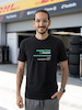 تیشرت طرح رادیو فرمول یک | F1 Team Radio  BOX BOX! — RADIO CHECK  تیشرت طرح رادیو فرمول یک برای طرفداران لحظاتی طراحی شده که در کنار صدای موتور و هیجان مسابقه، یکی از جذاب‌ترین بخش‌های فرمول یک را می‌سازند: Team Radio.  از یک دستور ساده مثل «Box, box!» گرفته تا اعتراض‌های عجیب، فریادهای هیجانی، درخواست استراتژی و دیالوگ‌های فراموش‌نشدنی راننده‌ها و مهندسان مسابقه، رادیوی تیمی بخشی جدانشدنی از دنیای مدرن فرمول یک است.  اگر برای شما F1 فقط دیدن ماشین‌ها نیست و از شنیدن رادیوهای راننده‌ها در طول مسابقه لذت می‌برید، این تیشرت دقیقاً برای همین علاقه طراحی شده است.  🏎️ Team Radio؛ صدای واقعی مسابقه  در فرمول یک، راننده در طول مسابقه دائماً با مهندس مسابقه و تیم خودش در ارتباط است.  در چند ثانیه ممکن است درباره لاستیک‌ها، استراتژی، وضعیت خودرو، ترافیک، فاصله با رقبا، پیت‌استاپ و شرایط پیست صحبت شود.  اما چیزی که Team Radio را برای هواداران جذاب‌تر می‌کند، فقط اطلاعات فنی نیست.  گاهی یک جمله کوتاه می‌تواند تمام احساسات یک مسابقه را نشان دهد:  خشم، استرس، ناامیدی، هیجان، خوشحالی و حتی شوخی.  🎙️ وقتی راننده میکروفون را باز می‌کند...  یکی از جذاب‌ترین لحظات برای طرفداران فرمول یک زمانی است که صدای رادیوی راننده وارد پخش مسابقه می‌شود.  ممکن است راننده آرام و دقیق درباره لاستیک صحبت کند؛ چند دور بعد عصبانی شود؛ بعد از یک سبقت فریاد بزند یا پس از یک پیروزی از خوشحالی نتواند احساساتش را کنترل کند.  همین لحظات غیرقابل‌پیش‌بینی باعث شده F1 Team Radio به بخشی از فرهنگ هواداری فرمول یک تبدیل شود.  🔥 BOX, BOX!  اگر فرمول یک را دنبال کرده باشید، احتمالاً بارها عبارت معروف:  BOX, BOX!  را شنیده‌اید.  این یکی از شناخته‌شده‌ترین فرمان‌های رادیویی در F1 است؛ دستوری برای ورود راننده به Pit Lane و انجام پیت‌استاپ.  اما Team Radio فقط درباره پیت‌استاپ نیست.  گاهی یک جمله ساده از طرف مهندس می‌تواند استراتژی کل مسابقه را تغییر دهد و گاهی یک واکنش چندکلمه‌ای از راننده به یکی از ماندگارترین لحظات آخر هفته مسابقه تبدیل می‌شود.  🏁 برای طرفداران واقعی فرمول یک  تیشرت F1 Team Radio (1) برای کسانی است که جزئیات کوچک اما مهم این ورزش را دوست دارند.  مناسب برای:  طرفداران Formula 1  علاقه‌مندان به F1 Team Radio  طرفداران مسابقات اتومبیل‌رانی  علاقه‌مندان به Motorsport  طرفداران راننده‌های F1  علاقه‌مندان به استراتژی و مهندسی مسابقه  گیمرهای Racing  طرفداران F1 و Racing Culture  🎧 صدای پشت فرمان  فرمول یک فقط صدای موتور نیست.  پشت هر دور سریع، مجموعه‌ای از تصمیم‌ها، محاسبات و ارتباطات قرار دارد.  راننده در سرعت‌های بسیار بالا باید خودرو را کنترل کند و هم‌زمان اطلاعاتی را از تیم دریافت کند؛ از وضعیت لاستیک گرفته تا فاصله با رقیب و زمان مناسب برای پیت‌استاپ.  Team Radio بخشی از همین ارتباط است؛ صدایی که اجازه می‌دهد برای چند لحظه وارد کابین راننده شویم و فشار واقعی مسابقه را بشنویم.  👕 جنس و کیفیت تیشرت  برای تولید این محصول از پارچه نخ پنبه خالص استفاده شده است؛ پارچه‌ای نرم، راحت و مناسب استفاده روزمره.  این تیشرت را می‌توانید با شلوار جین، مشکی یا کارگو و همچنین کت یا هودی ترکیب کنید و یک استایل Racing / Streetwear بسازید.  🎨 چاپ طرح F1 Team Radio  طرح رادیو فرمول یک (1) با دقت روی پارچه اجرا شده تا جزئیات گرافیکی آن به خوبی دیده شود.  برای حفظ کیفیت چاپ و افزایش دوام آن، توصیه می‌شود تیشرت را با آب سرد و طبق اصول صحیح شستشو بشویید و از روش‌های نامناسب شستشو که ممکن است به چاپ آسیب بزند، خودداری کنید.  🏎️ برای کسانی که صدای مسابقه را می‌شناسند  ممکن است یک نفر فقط صدای موتور را بشنود.  اما یک طرفدار فرمول یک می‌داند که وقتی صدای رادیو می‌آید، ممکن است اتفاق مهمی در راه باشد.  یک دستور پیت‌استاپ.  یک هشدار.  یک اعتراض.  یک استراتژی جدید.  یا شاید جمله‌ای که چند ساعت بعد همه طرفداران درباره‌اش صحبت کنند.  تیشرت F1 Team Radio (1) ادای احترامی است به همین بخش جذاب و غیرقابل‌پیش‌بینی دنیای فرمول یک.  Lights out. Radio on.  📏 سایزبندی  تیشرت طرح F1 Team Radio (1) در سایزهای استاندارد زیر ارائه می‌شود:  L  XL  XXL  برای انتخاب دقیق سایز، قبل از ثبت سفارش حتماً جدول سایزبندی را بررسی کنید.  🎨 رنگ‌بندی  این محصول در رنگ‌های موجود در صفحه محصول قابل سفارش است.  هنگام ثبت سفارش، رنگ و سایز موردنظر خود را انتخاب کنید.  📦 ارسال رایگان به سراسر ایران  ارسال این محصول به تمام نقاط ایران رایگان است.  🛒 چرا تیشرت طرح رادیو فرمول یک (1)؟  طراحی با الهام از F1 Team Radio  مناسب طرفداران واقعی فرمول یک  الهام‌گرفته از ارتباط راننده و مهندس مسابقه  مناسب علاقه‌مندان به Motorsport و Racing  انتخابی متفاوت برای طرفداران F1  مناسب استایل Racing و Streetwear  پارچه نخ پنبه خالص  چاپ با اجرای دقیق  مناسب استفاده روزمره  سایزبندی L / XL / XXL  ارسال رایگان به سراسر ایران  مشخصات محصول  ویژگی  مشخصات  نام محصول  تیشرت طرح رادیو فرمول یک (1)  دسته‌بندی  فرمول یک  جنس  نخ پنبه خالص  سایز  L / XL / XXL  سبک  F1 / Team Radio / Motorsport  الهام طراحی  رادیوهای راننده‌ها و مهندسان F1  مناسب برای  طرفداران Formula 1 و Motorsport  ارسال  رایگان به سراسر ایران  کلمات کلیدی مرتبط  تیشرت فرمول یک، تیشرت F1، تیشرت طرح فرمول یک، تیشرت رادیو فرمول یک، تیشرت F1 Team Radio، تیشرت Team Radio، تیشرت رادیویی F1، تیشرت راننده فرمول یک، تیشرت Motorsport، تیشرت موتوراسپرت، تیشرت Racing، تیشرت مسابقه‌ای، تیشرت Formula 1، تیشرت F1 Fan، تیشرت طرفداران فرمول یک، تیشرت Box Box، تیشرت Box Box Box، تیشرت Pit Stop، تیشرت Racing Culture، تیشرت گرافیکی فرمول یک، تیشرت طرح F1، تیشرت ماشین مسابقه، لباس فرمول یک، تیشرت مخصوص طرفداران F1، تیشرت استایل Racing
