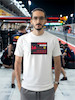 تیشرت طرح رادیو فرمول یک | F1 Team Radio  BOX BOX! — RADIO CHECK  تیشرت طرح رادیو فرمول یک برای طرفداران لحظاتی طراحی شده که در کنار صدای موتور و هیجان مسابقه، یکی از جذاب‌ترین بخش‌های فرمول یک را می‌سازند: Team Radio.  از یک دستور ساده مثل «Box, box!» گرفته تا اعتراض‌های عجیب، فریادهای هیجانی، درخواست استراتژی و دیالوگ‌های فراموش‌نشدنی راننده‌ها و مهندسان مسابقه، رادیوی تیمی بخشی جدانشدنی از دنیای مدرن فرمول یک است.  اگر برای شما F1 فقط دیدن ماشین‌ها نیست و از شنیدن رادیوهای راننده‌ها در طول مسابقه لذت می‌برید، این تیشرت دقیقاً برای همین علاقه طراحی شده است.  🏎️ Team Radio؛ صدای واقعی مسابقه  در فرمول یک، راننده در طول مسابقه دائماً با مهندس مسابقه و تیم خودش در ارتباط است.  در چند ثانیه ممکن است درباره لاستیک‌ها، استراتژی، وضعیت خودرو، ترافیک، فاصله با رقبا، پیت‌استاپ و شرایط پیست صحبت شود.  اما چیزی که Team Radio را برای هواداران جذاب‌تر می‌کند، فقط اطلاعات فنی نیست.  گاهی یک جمله کوتاه می‌تواند تمام احساسات یک مسابقه را نشان دهد:  خشم، استرس، ناامیدی، هیجان، خوشحالی و حتی شوخی.  🎙️ وقتی راننده میکروفون را باز می‌کند...  یکی از جذاب‌ترین لحظات برای طرفداران فرمول یک زمانی است که صدای رادیوی راننده وارد پخش مسابقه می‌شود.  ممکن است راننده آرام و دقیق درباره لاستیک صحبت کند؛ چند دور بعد عصبانی شود؛ بعد از یک سبقت فریاد بزند یا پس از یک پیروزی از خوشحالی نتواند احساساتش را کنترل کند.  همین لحظات غیرقابل‌پیش‌بینی باعث شده F1 Team Radio به بخشی از فرهنگ هواداری فرمول یک تبدیل شود.  🔥 BOX, BOX!  اگر فرمول یک را دنبال کرده باشید، احتمالاً بارها عبارت معروف:  BOX, BOX!  را شنیده‌اید.  این یکی از شناخته‌شده‌ترین فرمان‌های رادیویی در F1 است؛ دستوری برای ورود راننده به Pit Lane و انجام پیت‌استاپ.  اما Team Radio فقط درباره پیت‌استاپ نیست.  گاهی یک جمله ساده از طرف مهندس می‌تواند استراتژی کل مسابقه را تغییر دهد و گاهی یک واکنش چندکلمه‌ای از راننده به یکی از ماندگارترین لحظات آخر هفته مسابقه تبدیل می‌شود.  🏁 برای طرفداران واقعی فرمول یک  تیشرت F1 Team Radio (1) برای کسانی است که جزئیات کوچک اما مهم این ورزش را دوست دارند.  مناسب برای:  طرفداران Formula 1  علاقه‌مندان به F1 Team Radio  طرفداران مسابقات اتومبیل‌رانی  علاقه‌مندان به Motorsport  طرفداران راننده‌های F1  علاقه‌مندان به استراتژی و مهندسی مسابقه  گیمرهای Racing  طرفداران F1 و Racing Culture  🎧 صدای پشت فرمان  فرمول یک فقط صدای موتور نیست.  پشت هر دور سریع، مجموعه‌ای از تصمیم‌ها، محاسبات و ارتباطات قرار دارد.  راننده در سرعت‌های بسیار بالا باید خودرو را کنترل کند و هم‌زمان اطلاعاتی را از تیم دریافت کند؛ از وضعیت لاستیک گرفته تا فاصله با رقیب و زمان مناسب برای پیت‌استاپ.  Team Radio بخشی از همین ارتباط است؛ صدایی که اجازه می‌دهد برای چند لحظه وارد کابین راننده شویم و فشار واقعی مسابقه را بشنویم.  👕 جنس و کیفیت تیشرت  برای تولید این محصول از پارچه نخ پنبه خالص استفاده شده است؛ پارچه‌ای نرم، راحت و مناسب استفاده روزمره.  این تیشرت را می‌توانید با شلوار جین، مشکی یا کارگو و همچنین کت یا هودی ترکیب کنید و یک استایل Racing / Streetwear بسازید.  🎨 چاپ طرح F1 Team Radio  طرح رادیو فرمول یک (1) با دقت روی پارچه اجرا شده تا جزئیات گرافیکی آن به خوبی دیده شود.  برای حفظ کیفیت چاپ و افزایش دوام آن، توصیه می‌شود تیشرت را با آب سرد و طبق اصول صحیح شستشو بشویید و از روش‌های نامناسب شستشو که ممکن است به چاپ آسیب بزند، خودداری کنید.  🏎️ برای کسانی که صدای مسابقه را می‌شناسند  ممکن است یک نفر فقط صدای موتور را بشنود.  اما یک طرفدار فرمول یک می‌داند که وقتی صدای رادیو می‌آید، ممکن است اتفاق مهمی در راه باشد.  یک دستور پیت‌استاپ.  یک هشدار.  یک اعتراض.  یک استراتژی جدید.  یا شاید جمله‌ای که چند ساعت بعد همه طرفداران درباره‌اش صحبت کنند.  تیشرت F1 Team Radio (1) ادای احترامی است به همین بخش جذاب و غیرقابل‌پیش‌بینی دنیای فرمول یک.  Lights out. Radio on.  📏 سایزبندی  تیشرت طرح F1 Team Radio (1) در سایزهای استاندارد زیر ارائه می‌شود:  L  XL  XXL  برای انتخاب دقیق سایز، قبل از ثبت سفارش حتماً جدول سایزبندی را بررسی کنید.  🎨 رنگ‌بندی  این محصول در رنگ‌های موجود در صفحه محصول قابل سفارش است.  هنگام ثبت سفارش، رنگ و سایز موردنظر خود را انتخاب کنید.  📦 ارسال رایگان به سراسر ایران  ارسال این محصول به تمام نقاط ایران رایگان است.  🛒 چرا تیشرت طرح رادیو فرمول یک (1)؟  طراحی با الهام از F1 Team Radio  مناسب طرفداران واقعی فرمول یک  الهام‌گرفته از ارتباط راننده و مهندس مسابقه  مناسب علاقه‌مندان به Motorsport و Racing  انتخابی متفاوت برای طرفداران F1  مناسب استایل Racing و Streetwear  پارچه نخ پنبه خالص  چاپ با اجرای دقیق  مناسب استفاده روزمره  سایزبندی L / XL / XXL  ارسال رایگان به سراسر ایران  مشخصات محصول  ویژگی  مشخصات  نام محصول  تیشرت طرح رادیو فرمول یک (1)  دسته‌بندی  فرمول یک  جنس  نخ پنبه خالص  سایز  L / XL / XXL  سبک  F1 / Team Radio / Motorsport  الهام طراحی  رادیوهای راننده‌ها و مهندسان F1  مناسب برای  طرفداران Formula 1 و Motorsport  ارسال  رایگان به سراسر ایران  کلمات کلیدی مرتبط  تیشرت فرمول یک، تیشرت F1، تیشرت طرح فرمول یک، تیشرت رادیو فرمول یک، تیشرت F1 Team Radio، تیشرت Team Radio، تیشرت رادیویی F1، تیشرت راننده فرمول یک، تیشرت Motorsport، تیشرت موتوراسپرت، تیشرت Racing، تیشرت مسابقه‌ای، تیشرت Formula 1، تیشرت F1 Fan، تیشرت طرفداران فرمول یک، تیشرت Box Box، تیشرت Box Box Box، تیشرت Pit Stop، تیشرت Racing Culture، تیشرت گرافیکی فرمول یک، تیشرت طرح F1، تیشرت ماشین مسابقه، لباس فرمول یک، تیشرت مخصوص طرفداران F1، تیشرت استایل Racing