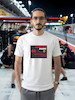 تیشرت طرح رادیو فرمول یک | F1 Team Radio  BOX BOX! — RADIO CHECK  تیشرت طرح رادیو فرمول یک برای طرفداران لحظاتی طراحی شده که در کنار صدای موتور و هیجان مسابقه، یکی از جذاب‌ترین بخش‌های فرمول یک را می‌سازند: Team Radio.  از یک دستور ساده مثل «Box, box!» گرفته تا اعتراض‌های عجیب، فریادهای هیجانی، درخواست استراتژی و دیالوگ‌های فراموش‌نشدنی راننده‌ها و مهندسان مسابقه، رادیوی تیمی بخشی جدانشدنی از دنیای مدرن فرمول یک است.  اگر برای شما F1 فقط دیدن ماشین‌ها نیست و از شنیدن رادیوهای راننده‌ها در طول مسابقه لذت می‌برید، این تیشرت دقیقاً برای همین علاقه طراحی شده است.  🏎️ Team Radio؛ صدای واقعی مسابقه  در فرمول یک، راننده در طول مسابقه دائماً با مهندس مسابقه و تیم خودش در ارتباط است.  در چند ثانیه ممکن است درباره لاستیک‌ها، استراتژی، وضعیت خودرو، ترافیک، فاصله با رقبا، پیت‌استاپ و شرایط پیست صحبت شود.  اما چیزی که Team Radio را برای هواداران جذاب‌تر می‌کند، فقط اطلاعات فنی نیست.  گاهی یک جمله کوتاه می‌تواند تمام احساسات یک مسابقه را نشان دهد:  خشم، استرس، ناامیدی، هیجان، خوشحالی و حتی شوخی.  🎙️ وقتی راننده میکروفون را باز می‌کند...  یکی از جذاب‌ترین لحظات برای طرفداران فرمول یک زمانی است که صدای رادیوی راننده وارد پخش مسابقه می‌شود.  ممکن است راننده آرام و دقیق درباره لاستیک صحبت کند؛ چند دور بعد عصبانی شود؛ بعد از یک سبقت فریاد بزند یا پس از یک پیروزی از خوشحالی نتواند احساساتش را کنترل کند.  همین لحظات غیرقابل‌پیش‌بینی باعث شده F1 Team Radio به بخشی از فرهنگ هواداری فرمول یک تبدیل شود.  🔥 BOX, BOX!  اگر فرمول یک را دنبال کرده باشید، احتمالاً بارها عبارت معروف:  BOX, BOX!  را شنیده‌اید.  این یکی از شناخته‌شده‌ترین فرمان‌های رادیویی در F1 است؛ دستوری برای ورود راننده به Pit Lane و انجام پیت‌استاپ.  اما Team Radio فقط درباره پیت‌استاپ نیست.  گاهی یک جمله ساده از طرف مهندس می‌تواند استراتژی کل مسابقه را تغییر دهد و گاهی یک واکنش چندکلمه‌ای از راننده به یکی از ماندگارترین لحظات آخر هفته مسابقه تبدیل می‌شود.  🏁 برای طرفداران واقعی فرمول یک  تیشرت F1 Team Radio (1) برای کسانی است که جزئیات کوچک اما مهم این ورزش را دوست دارند.  مناسب برای:  طرفداران Formula 1  علاقه‌مندان به F1 Team Radio  طرفداران مسابقات اتومبیل‌رانی  علاقه‌مندان به Motorsport  طرفداران راننده‌های F1  علاقه‌مندان به استراتژی و مهندسی مسابقه  گیمرهای Racing  طرفداران F1 و Racing Culture  🎧 صدای پشت فرمان  فرمول یک فقط صدای موتور نیست.  پشت هر دور سریع، مجموعه‌ای از تصمیم‌ها، محاسبات و ارتباطات قرار دارد.  راننده در سرعت‌های بسیار بالا باید خودرو را کنترل کند و هم‌زمان اطلاعاتی را از تیم دریافت کند؛ از وضعیت لاستیک گرفته تا فاصله با رقیب و زمان مناسب برای پیت‌استاپ.  Team Radio بخشی از همین ارتباط است؛ صدایی که اجازه می‌دهد برای چند لحظه وارد کابین راننده شویم و فشار واقعی مسابقه را بشنویم.  👕 جنس و کیفیت تیشرت  برای تولید این محصول از پارچه نخ پنبه خالص استفاده شده است؛ پارچه‌ای نرم، راحت و مناسب استفاده روزمره.  این تیشرت را می‌توانید با شلوار جین، مشکی یا کارگو و همچنین کت یا هودی ترکیب کنید و یک استایل Racing / Streetwear بسازید.  🎨 چاپ طرح F1 Team Radio  طرح رادیو فرمول یک (1) با دقت روی پارچه اجرا شده تا جزئیات گرافیکی آن به خوبی دیده شود.  برای حفظ کیفیت چاپ و افزایش دوام آن، توصیه می‌شود تیشرت را با آب سرد و طبق اصول صحیح شستشو بشویید و از روش‌های نامناسب شستشو که ممکن است به چاپ آسیب بزند، خودداری کنید.  🏎️ برای کسانی که صدای مسابقه را می‌شناسند  ممکن است یک نفر فقط صدای موتور را بشنود.  اما یک طرفدار فرمول یک می‌داند که وقتی صدای رادیو می‌آید، ممکن است اتفاق مهمی در راه باشد.  یک دستور پیت‌استاپ.  یک هشدار.  یک اعتراض.  یک استراتژی جدید.  یا شاید جمله‌ای که چند ساعت بعد همه طرفداران درباره‌اش صحبت کنند.  تیشرت F1 Team Radio (1) ادای احترامی است به همین بخش جذاب و غیرقابل‌پیش‌بینی دنیای فرمول یک.  Lights out. Radio on.  📏 سایزبندی  تیشرت طرح F1 Team Radio (1) در سایزهای استاندارد زیر ارائه می‌شود:  L  XL  XXL  برای انتخاب دقیق سایز، قبل از ثبت سفارش حتماً جدول سایزبندی را بررسی کنید.  🎨 رنگ‌بندی  این محصول در رنگ‌های موجود در صفحه محصول قابل سفارش است.  هنگام ثبت سفارش، رنگ و سایز موردنظر خود را انتخاب کنید.  📦 ارسال رایگان به سراسر ایران  ارسال این محصول به تمام نقاط ایران رایگان است.  🛒 چرا تیشرت طرح رادیو فرمول یک (1)؟  طراحی با الهام از F1 Team Radio  مناسب طرفداران واقعی فرمول یک  الهام‌گرفته از ارتباط راننده و مهندس مسابقه  مناسب علاقه‌مندان به Motorsport و Racing  انتخابی متفاوت برای طرفداران F1  مناسب استایل Racing و Streetwear  پارچه نخ پنبه خالص  چاپ با اجرای دقیق  مناسب استفاده روزمره  سایزبندی L / XL / XXL  ارسال رایگان به سراسر ایران  مشخصات محصول  ویژگی  مشخصات  نام محصول  تیشرت طرح رادیو فرمول یک (1)  دسته‌بندی  فرمول یک  جنس  نخ پنبه خالص  سایز  L / XL / XXL  سبک  F1 / Team Radio / Motorsport  الهام طراحی  رادیوهای راننده‌ها و مهندسان F1  مناسب برای  طرفداران Formula 1 و Motorsport  ارسال  رایگان به سراسر ایران  کلمات کلیدی مرتبط  تیشرت فرمول یک، تیشرت F1، تیشرت طرح فرمول یک، تیشرت رادیو فرمول یک، تیشرت F1 Team Radio، تیشرت Team Radio، تیشرت رادیویی F1، تیشرت راننده فرمول یک، تیشرت Motorsport، تیشرت موتوراسپرت، تیشرت Racing، تیشرت مسابقه‌ای، تیشرت Formula 1، تیشرت F1 Fan، تیشرت طرفداران فرمول یک، تیشرت Box Box، تیشرت Box Box Box، تیشرت Pit Stop، تیشرت Racing Culture، تیشرت گرافیکی فرمول یک، تیشرت طرح F1، تیشرت ماشین مسابقه، لباس فرمول یک، تیشرت مخصوص طرفداران F1، تیشرت استایل Racing