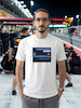 تیشرت طرح رادیو فرمول یک | F1 Team Radio  BOX BOX! — RADIO CHECK  تیشرت طرح رادیو فرمول یک برای طرفداران لحظاتی طراحی شده که در کنار صدای موتور و هیجان مسابقه، یکی از جذاب‌ترین بخش‌های فرمول یک را می‌سازند: Team Radio.  از یک دستور ساده مثل «Box, box!» گرفته تا اعتراض‌های عجیب، فریادهای هیجانی، درخواست استراتژی و دیالوگ‌های فراموش‌نشدنی راننده‌ها و مهندسان مسابقه، رادیوی تیمی بخشی جدانشدنی از دنیای مدرن فرمول یک است.  اگر برای شما F1 فقط دیدن ماشین‌ها نیست و از شنیدن رادیوهای راننده‌ها در طول مسابقه لذت می‌برید، این تیشرت دقیقاً برای همین علاقه طراحی شده است.  🏎️ Team Radio؛ صدای واقعی مسابقه  در فرمول یک، راننده در طول مسابقه دائماً با مهندس مسابقه و تیم خودش در ارتباط است.  در چند ثانیه ممکن است درباره لاستیک‌ها، استراتژی، وضعیت خودرو، ترافیک، فاصله با رقبا، پیت‌استاپ و شرایط پیست صحبت شود.  اما چیزی که Team Radio را برای هواداران جذاب‌تر می‌کند، فقط اطلاعات فنی نیست.  گاهی یک جمله کوتاه می‌تواند تمام احساسات یک مسابقه را نشان دهد:  خشم، استرس، ناامیدی، هیجان، خوشحالی و حتی شوخی.  🎙️ وقتی راننده میکروفون را باز می‌کند...  یکی از جذاب‌ترین لحظات برای طرفداران فرمول یک زمانی است که صدای رادیوی راننده وارد پخش مسابقه می‌شود.  ممکن است راننده آرام و دقیق درباره لاستیک صحبت کند؛ چند دور بعد عصبانی شود؛ بعد از یک سبقت فریاد بزند یا پس از یک پیروزی از خوشحالی نتواند احساساتش را کنترل کند.  همین لحظات غیرقابل‌پیش‌بینی باعث شده F1 Team Radio به بخشی از فرهنگ هواداری فرمول یک تبدیل شود.  🔥 BOX, BOX!  اگر فرمول یک را دنبال کرده باشید، احتمالاً بارها عبارت معروف:  BOX, BOX!  را شنیده‌اید.  این یکی از شناخته‌شده‌ترین فرمان‌های رادیویی در F1 است؛ دستوری برای ورود راننده به Pit Lane و انجام پیت‌استاپ.  اما Team Radio فقط درباره پیت‌استاپ نیست.  گاهی یک جمله ساده از طرف مهندس می‌تواند استراتژی کل مسابقه را تغییر دهد و گاهی یک واکنش چندکلمه‌ای از راننده به یکی از ماندگارترین لحظات آخر هفته مسابقه تبدیل می‌شود.  🏁 برای طرفداران واقعی فرمول یک  تیشرت F1 Team Radio (1) برای کسانی است که جزئیات کوچک اما مهم این ورزش را دوست دارند.  مناسب برای:  طرفداران Formula 1  علاقه‌مندان به F1 Team Radio  طرفداران مسابقات اتومبیل‌رانی  علاقه‌مندان به Motorsport  طرفداران راننده‌های F1  علاقه‌مندان به استراتژی و مهندسی مسابقه  گیمرهای Racing  طرفداران F1 و Racing Culture  🎧 صدای پشت فرمان  فرمول یک فقط صدای موتور نیست.  پشت هر دور سریع، مجموعه‌ای از تصمیم‌ها، محاسبات و ارتباطات قرار دارد.  راننده در سرعت‌های بسیار بالا باید خودرو را کنترل کند و هم‌زمان اطلاعاتی را از تیم دریافت کند؛ از وضعیت لاستیک گرفته تا فاصله با رقیب و زمان مناسب برای پیت‌استاپ.  Team Radio بخشی از همین ارتباط است؛ صدایی که اجازه می‌دهد برای چند لحظه وارد کابین راننده شویم و فشار واقعی مسابقه را بشنویم.  👕 جنس و کیفیت تیشرت  برای تولید این محصول از پارچه نخ پنبه خالص استفاده شده است؛ پارچه‌ای نرم، راحت و مناسب استفاده روزمره.  این تیشرت را می‌توانید با شلوار جین، مشکی یا کارگو و همچنین کت یا هودی ترکیب کنید و یک استایل Racing / Streetwear بسازید.  🎨 چاپ طرح F1 Team Radio  طرح رادیو فرمول یک (1) با دقت روی پارچه اجرا شده تا جزئیات گرافیکی آن به خوبی دیده شود.  برای حفظ کیفیت چاپ و افزایش دوام آن، توصیه می‌شود تیشرت را با آب سرد و طبق اصول صحیح شستشو بشویید و از روش‌های نامناسب شستشو که ممکن است به چاپ آسیب بزند، خودداری کنید.  🏎️ برای کسانی که صدای مسابقه را می‌شناسند  ممکن است یک نفر فقط صدای موتور را بشنود.  اما یک طرفدار فرمول یک می‌داند که وقتی صدای رادیو می‌آید، ممکن است اتفاق مهمی در راه باشد.  یک دستور پیت‌استاپ.  یک هشدار.  یک اعتراض.  یک استراتژی جدید.  یا شاید جمله‌ای که چند ساعت بعد همه طرفداران درباره‌اش صحبت کنند.  تیشرت F1 Team Radio (1) ادای احترامی است به همین بخش جذاب و غیرقابل‌پیش‌بینی دنیای فرمول یک.  Lights out. Radio on.  📏 سایزبندی  تیشرت طرح F1 Team Radio (1) در سایزهای استاندارد زیر ارائه می‌شود:  L  XL  XXL  برای انتخاب دقیق سایز، قبل از ثبت سفارش حتماً جدول سایزبندی را بررسی کنید.  🎨 رنگ‌بندی  این محصول در رنگ‌های موجود در صفحه محصول قابل سفارش است.  هنگام ثبت سفارش، رنگ و سایز موردنظر خود را انتخاب کنید.  📦 ارسال رایگان به سراسر ایران  ارسال این محصول به تمام نقاط ایران رایگان است.  🛒 چرا تیشرت طرح رادیو فرمول یک (1)؟  طراحی با الهام از F1 Team Radio  مناسب طرفداران واقعی فرمول یک  الهام‌گرفته از ارتباط راننده و مهندس مسابقه  مناسب علاقه‌مندان به Motorsport و Racing  انتخابی متفاوت برای طرفداران F1  مناسب استایل Racing و Streetwear  پارچه نخ پنبه خالص  چاپ با اجرای دقیق  مناسب استفاده روزمره  سایزبندی L / XL / XXL  ارسال رایگان به سراسر ایران  مشخصات محصول  ویژگی  مشخصات  نام محصول  تیشرت طرح رادیو فرمول یک (1)  دسته‌بندی  فرمول یک  جنس  نخ پنبه خالص  سایز  L / XL / XXL  سبک  F1 / Team Radio / Motorsport  الهام طراحی  رادیوهای راننده‌ها و مهندسان F1  مناسب برای  طرفداران Formula 1 و Motorsport  ارسال  رایگان به سراسر ایران  کلمات کلیدی مرتبط  تیشرت فرمول یک، تیشرت F1، تیشرت طرح فرمول یک، تیشرت رادیو فرمول یک، تیشرت F1 Team Radio، تیشرت Team Radio، تیشرت رادیویی F1، تیشرت راننده فرمول یک، تیشرت Motorsport، تیشرت موتوراسپرت، تیشرت Racing، تیشرت مسابقه‌ای، تیشرت Formula 1، تیشرت F1 Fan، تیشرت طرفداران فرمول یک، تیشرت Box Box، تیشرت Box Box Box، تیشرت Pit Stop، تیشرت Racing Culture، تیشرت گرافیکی فرمول یک، تیشرت طرح F1، تیشرت ماشین مسابقه، لباس فرمول یک، تیشرت مخصوص طرفداران F1، تیشرت استایل Racing