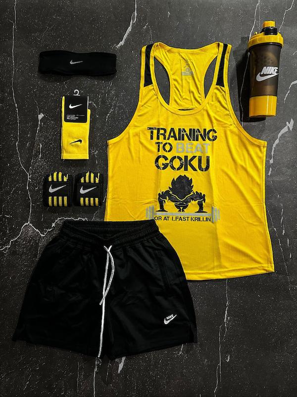 پکیج کد E1775 شامل رکابی قهرمانی + شلوارک کوتاه + جوراب ساقدار + شیکر دو تیکه + مچ بند چسب نانو + هدبند با تم زرد و مشکی 🖤💛