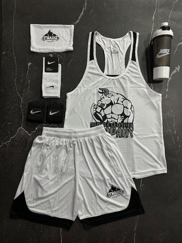 پکیج کد E1811 شامل رکابی قهرمانی + شلوارک + اسکارف + شیکر دوتیکه + مچ بند چسب نانو + جوراب ساقدار با تم سفید مشکی 🖤🤍