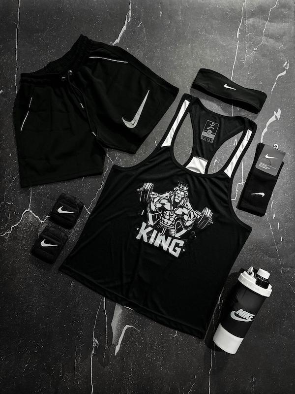 پکیج کد E1816 شامل رکابی قهرمانی + شلوارک غواصی + جوراب ساقدار + شیکر دو تیکه + مچ بند چسب نانو + هدبند با تم مشکی سفید 🖤🤍