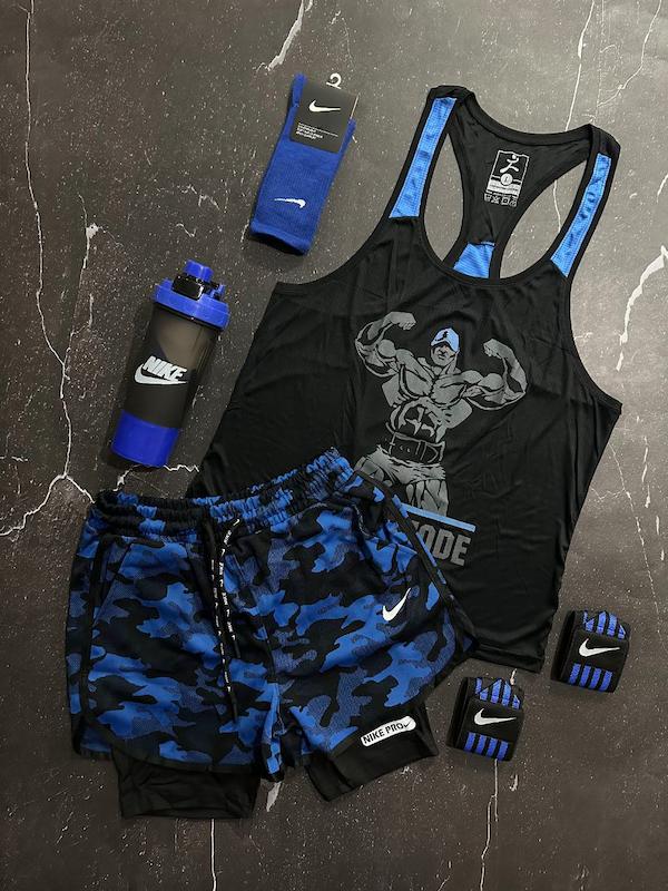 پکیج کد E1818 شامل رکابی قهرمانی + شلوارک کشاله دار + جوراب ساقدار + شیکر دو تیکه + مچ بند چسب نانو + هدبند با تم مشکی آبی 💙🖤