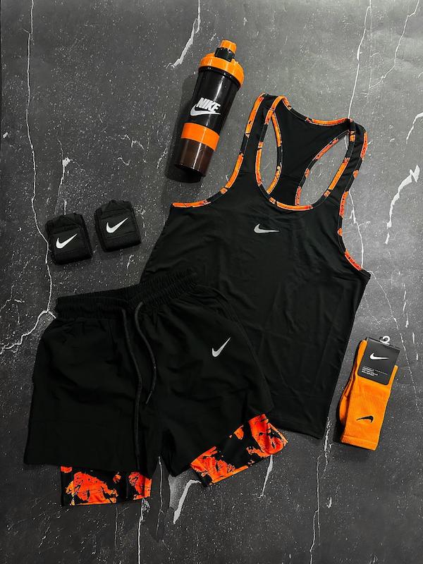 پکیج کد E1823 شامل رکابی قهرمانی + شلوارک کشاله دار + جوراب ساقدار + شیکر دو تیکه + مچ بند چسب نانو  با تم مشکی نارنجی 🖤🧡