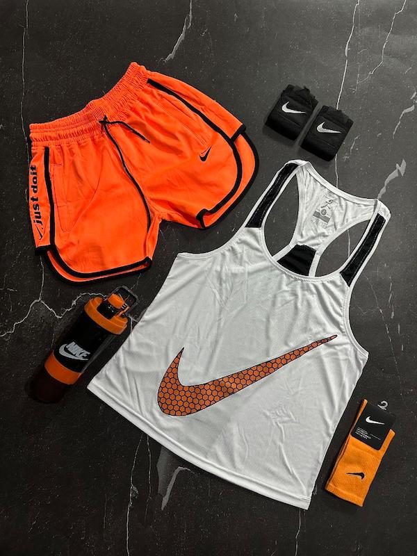 پکیج کد E1828  شامل رکابی قهرمانی + شلوارک غواصی + جوراب ساقدار + شیکر دو تیکه + مچ بند چسب نانو با تم سفید نارنجی 🧡🤍