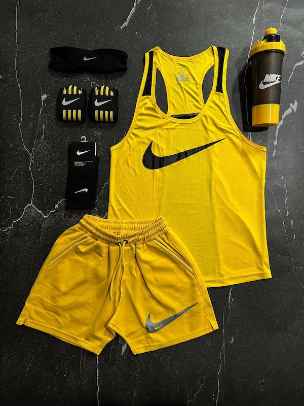 پکیج کد E1839 شامل رکابی قهرمانی + شلوارک غواصی + جوراب ساقدار + شیکر دو تیکه + مچ بند چسب نانو + هدبند با تم زرد💛