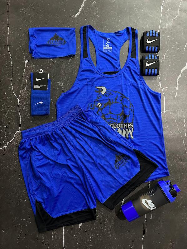 پکیج کد E1842 شامل رکابی قهرمانی + شلوارک + اسکارف + شیکر دوتیکه + مچ بند چسب نانو + جوراب ساقدار با تم آبی 💙