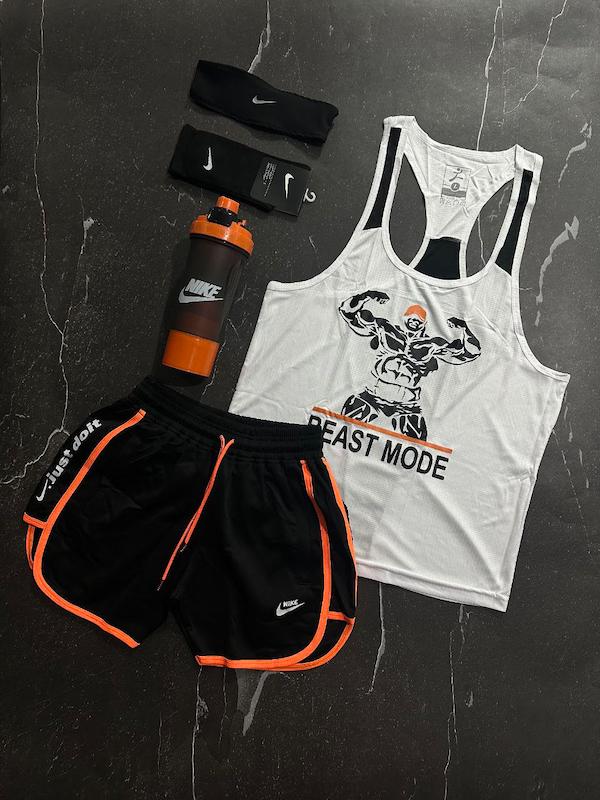 پکیج کد E1845 شامل رکابی قهرمانی + شلوارک غواصی + جوراب ساقدار + شیکر دو تیکه + هدبند با تم سفید و نارنجی 🧡🤍