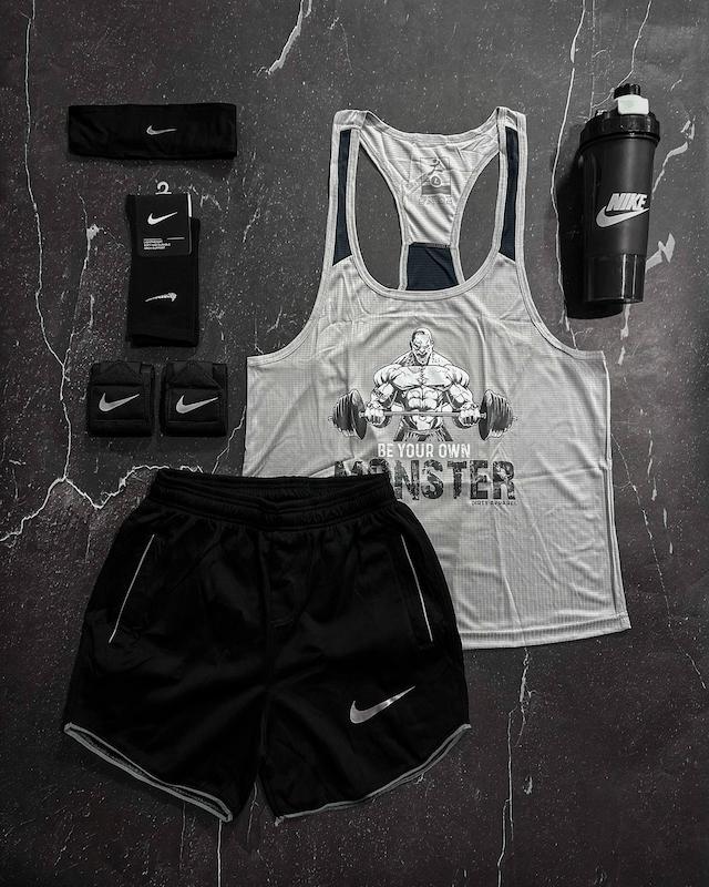 پکیج کد E1944 شامل رکابی قهرمانی + شلوارک + جوراب ساقدار + شیکر دو تیکه + مچ بند چسب نانو + هدبند با تم طوسی مشکی 🔥🖤