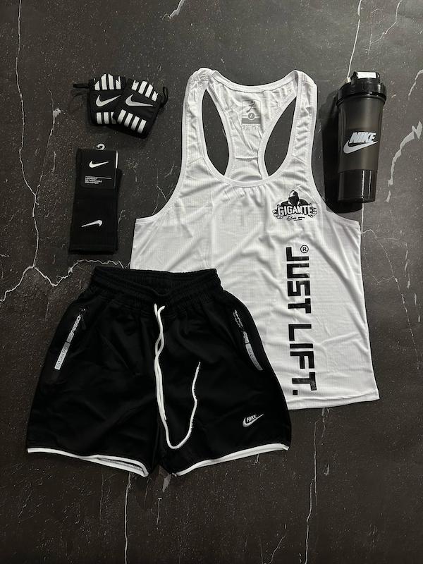 پکیج کد E1955 شامل رکابی قهرمانی + شلوارک + جوراب ساقدار + شیکر دو تیکه + مچ بند چسب نانو با تم سفید مشکی🤍🖤