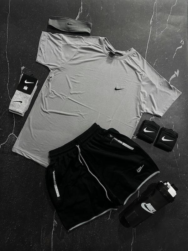 پکیج کد E1959 شامل تیشرت + شلوارک + شیکر دو تیکه + مچبند چسب نانو + جوراب ساقدار + هدبند با تم طوسی مشکی 😍🔥