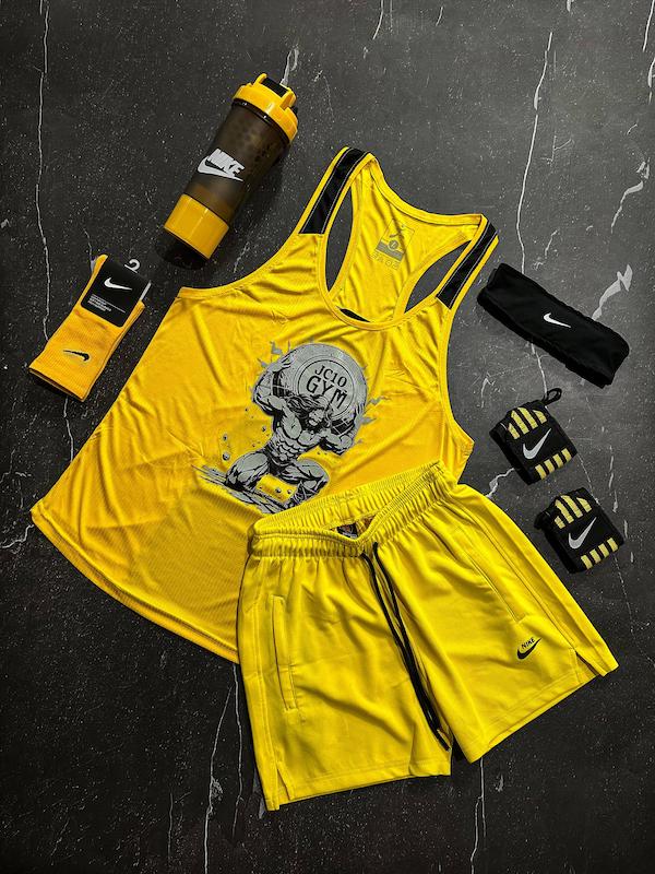 پکیج کد E1963 شامل رکابی قهرمانی + شلوارک + جوراب ساقدار + شیکر دو تیکه + مچ بند چسب نانو + هدبند با تم زرد 💛🔥