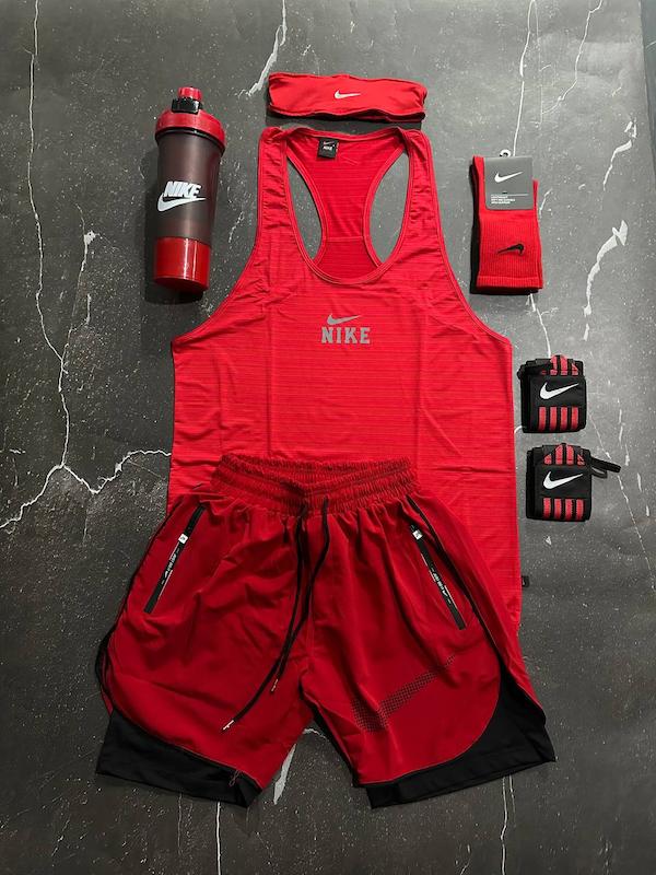 پکیج کد S3135 شامل رکابی قهرمانی + شلوارک کشاله دار + شیکر دو تیکه + مچبند چسب نانو + هدبند + جوراب ساقدار با تم قرمز