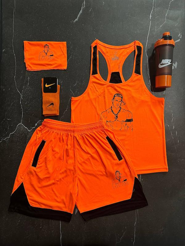 پکیج کد S3139 شامل رکابی قهرمانی + شلوارک + اسکارف + شیکر دو تیکه + جوراب ساقدار با تم نارنجی مشکی