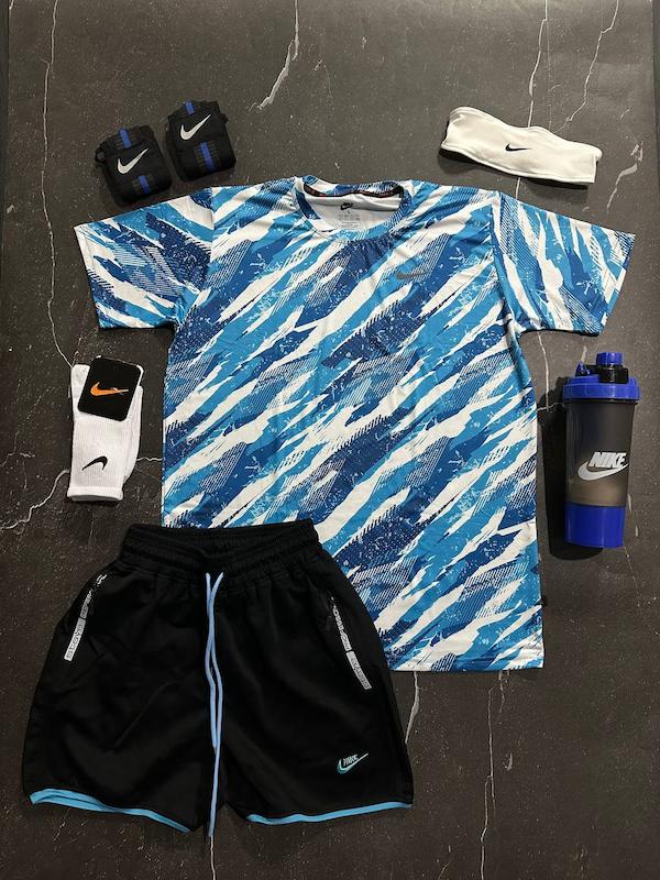 پکیج کد S3181 شامل تیشرت + شلوارک + هدبند + مچ بند چسب نانو + شیکر دو تیکه + جوراب ساقدار با تم آبی سفید