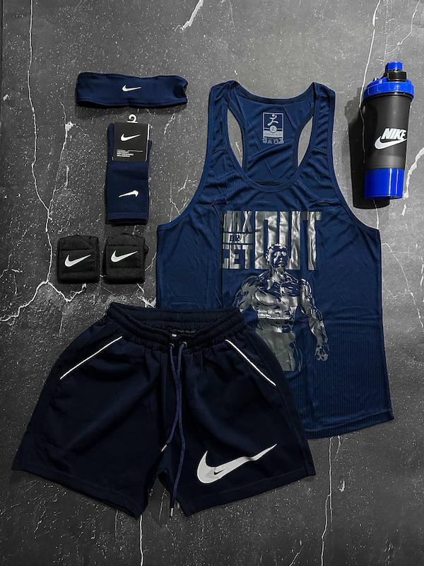 پکیج کد E1992 شامل رکابی قهرمانی + شلوارک + جوراب ساقدار + شیکر دو تیکه + مچ بند چسب نانو + هدبند با تم سرمه ای 💙🔥  