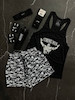 پکیج کد S3432 ست بدنسازی مردانه طرح استرانگ من با تم مشکی سفید 🤍🖤 شامل رکابی + شلوارک + مچبند + جوراب ساقدار + هدبند + شیکر دو تیکه