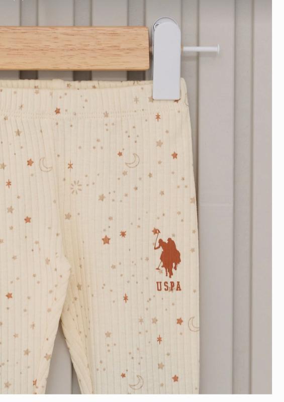ست ۳ تکه بلوز، شلوار جوراب‌دار و کلاه نوزادی دخترانه کرم یو.اس. پولو اسن | U.S. Polo Assn baby set