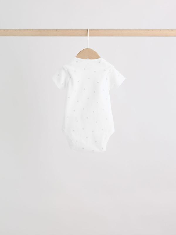 ست ۴ تکه سرهمی، بادی، کلاه و پیش‌بند نوزادی سفید نکست | Next baby clothes 