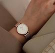 ساعت دنیل ولینگتون حصیری زنانه رزگلد صفحه سفید Daniel Wellington Rosegold