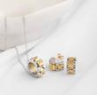 نیمست رولکس استیل طلایی نقره ای (گردنبند و‌گوشواره) ‏ Rolex steel necklace and earrings
