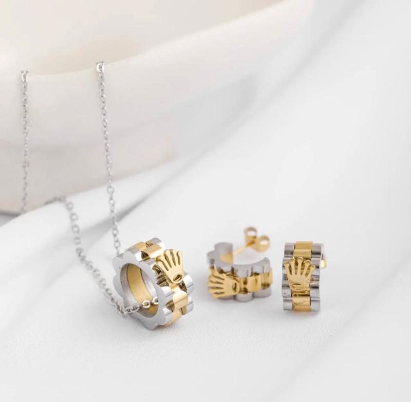 نیمست رولکس استیل طلایی نقره ای (گردنبند و‌گوشواره) ‏ Rolex steel necklace and earrings