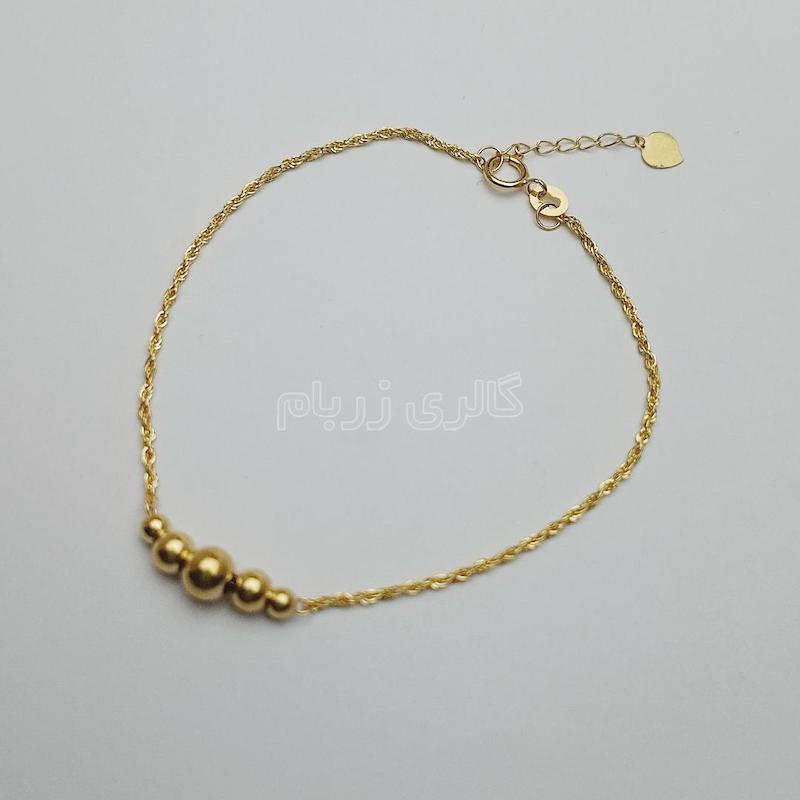 دستبند زنانه طلا ۱۸ عیار دستبند طنابی و گوی گالری زربام