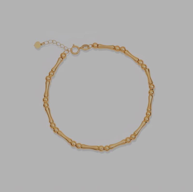 دستبند زنانه طلا ۱۸ عیار دستبند گوی و استخوانی وارداتی گالری کاژه گلد