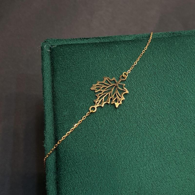 دستبند زنانه طلا ۱۸ عیار دستبند طرح برگ گالری حامی گلد