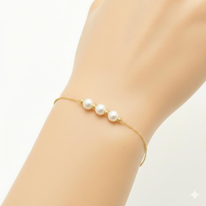دستبند زنانه طلا ۱۸ عیار مروارید و گوی با حلقه تنظیم سایز گالری شمش طلا